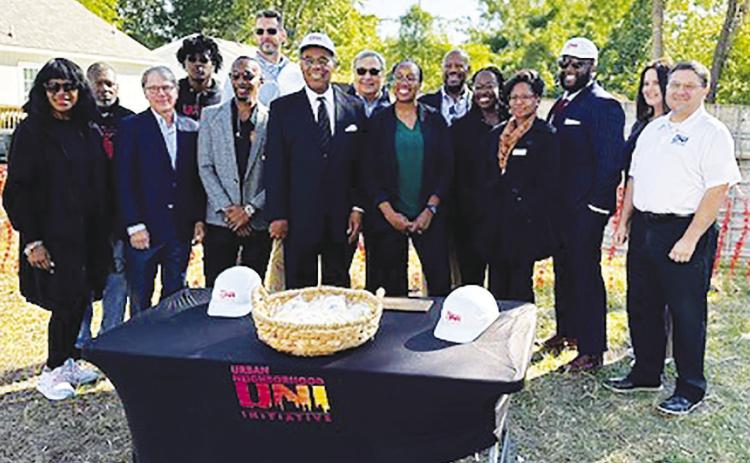 (Center) U.S. Representative Emanuel Cleaver, II (D-MO) on Monday joined Urban Neighborhood Initiative (UNI) leadership and community leaders to celebrate construction at the future site of nearly 100 affordable homes for families in underserved communities and present a check for $4 million in Community Project Funding the Congressman was able to secure. RELATED STORY ON PAGE 2.