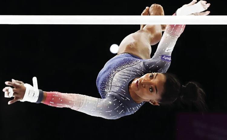 US gymnast Simone Biles competes on the uneven bars during the women’s team final at the Artistic Gymnastics World Championships in Antwerp, Belgium, on October 4, 2023 [Geert vanden Wijngaert/AP Photo]