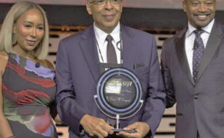 Lewis Diuguid (center) being inducted into the National Association of Black Journalists Hall of Fame. (Texas Metro News)