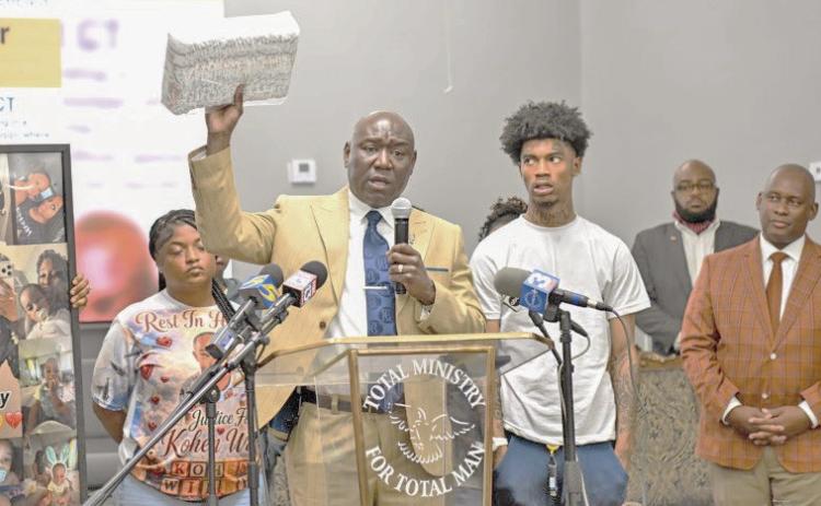 Family members of baby Kohen Wiley, including his father Davion Williams, right, join Atty. Ben Crump at a press conference in Senatobia, Mississippi, on Monday, June 22. (Gary S. Whitlock/Tri-State Defender)