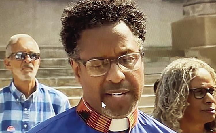 The Reverend Dr. Emanuel Cleaver, III speaks at a press conference in front of the Jackson County Courthouse. photo/screenshot