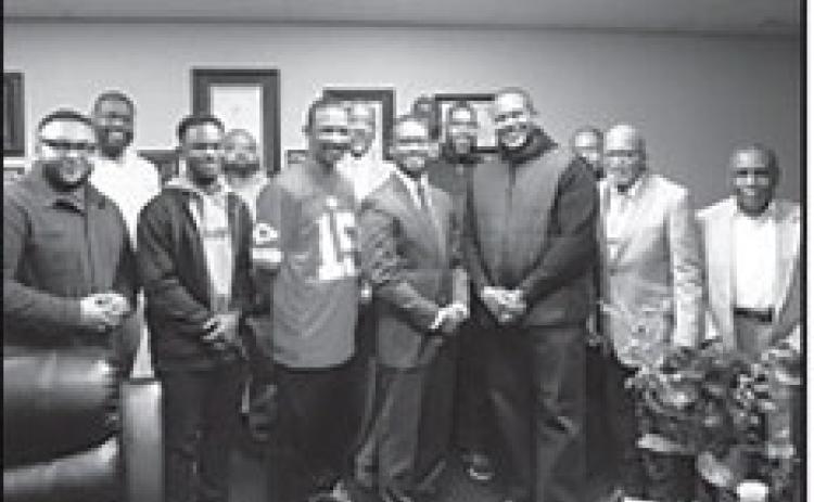 Missouri Rep. Anthony Ealy (center) is shown above with Bishop Stephens and members of the Trinity Temple Church of God in Christ. The church’s food pantry is open the fourth Wednesday of each month from 10 a.m. to 12 p.m.