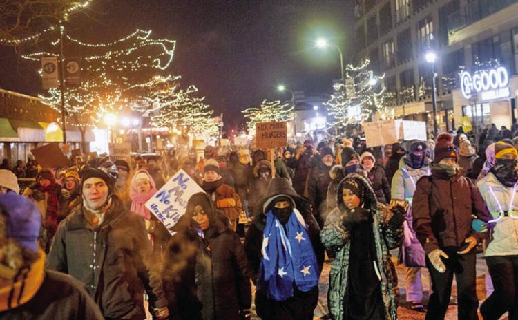 Hundreds gather around a growing memorial site at 26th Street and Nicollet Avenue South in Minneapolis, where federal agents shot and killed Alex Pretti Saturday, Jan. 24, 2026 earlier in the day. (Photo by Nicole Neri/Minnesota Reformer)