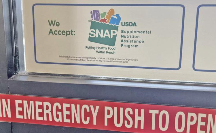 A sign advertises that SNAP benefits are accepted at a grocery store in Fargo, North Dakota, on July 7, 2026. (Photo by Ceilidh Kern for the North Dakota Monitor)