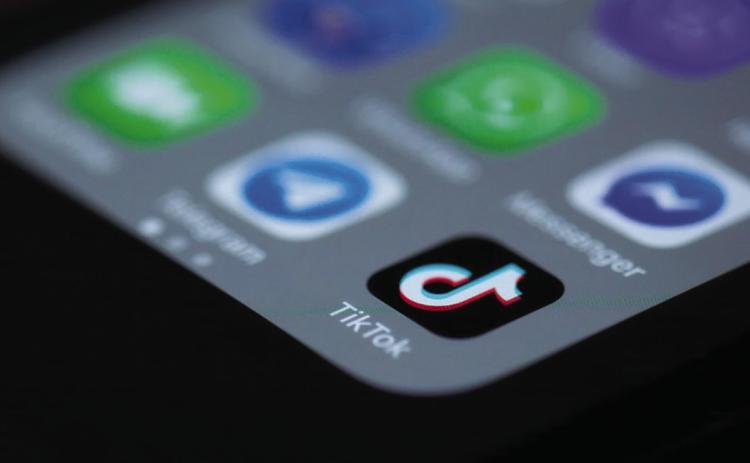 TikTok app icon on a mobile phone (Solen Feyissa, CC BY-SA 2.0 via Wikimedia Commons)