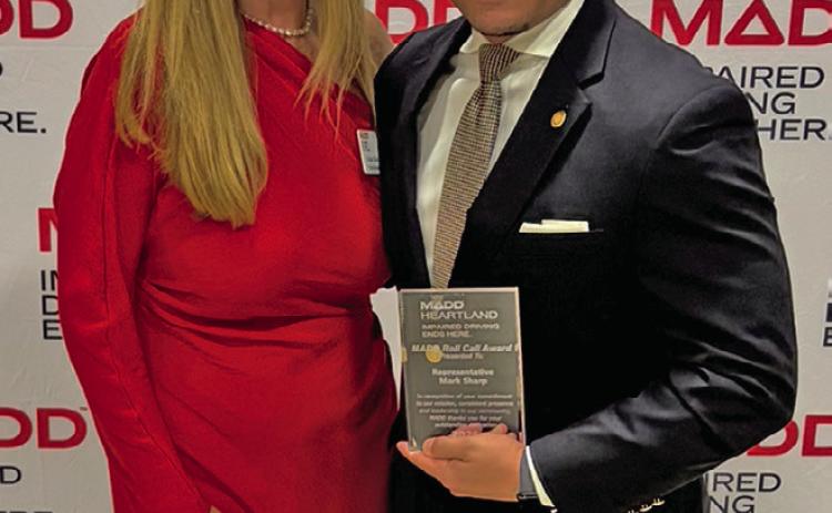 (Left) MADD victim services specialist Heather Elder presents Missouri State Representative Mark Sharp with the Roll Call Award.